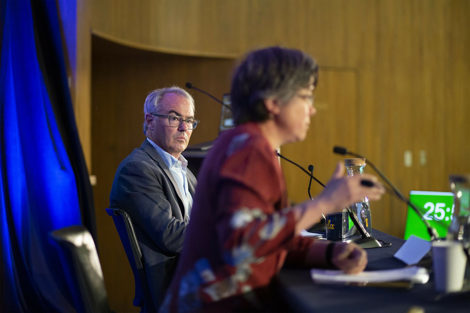 William Boyd, left, watching a speaker to his right