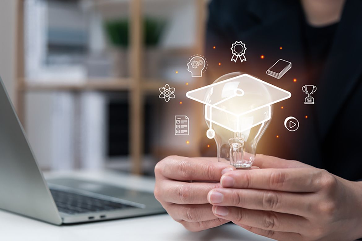 Hands holding a lightbulb surrounded by superimposed academic images 