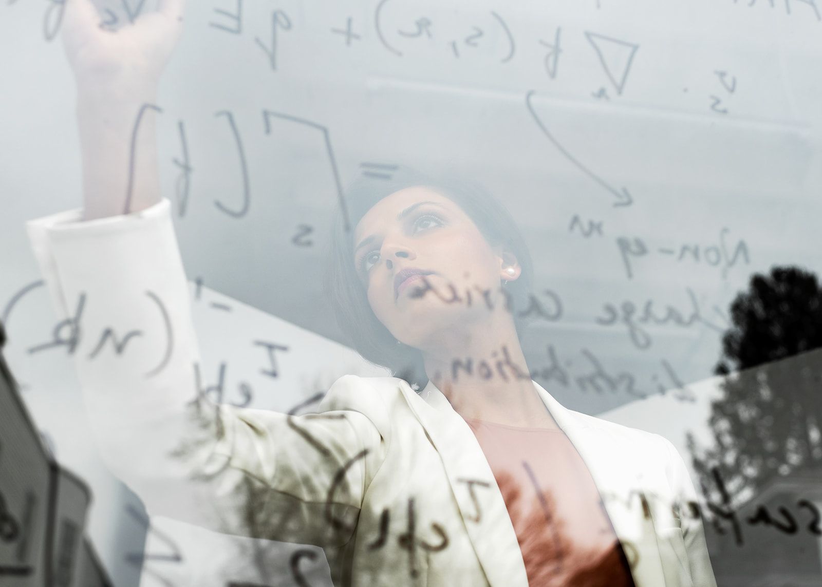 Prineha Narang writing on a transparent screen