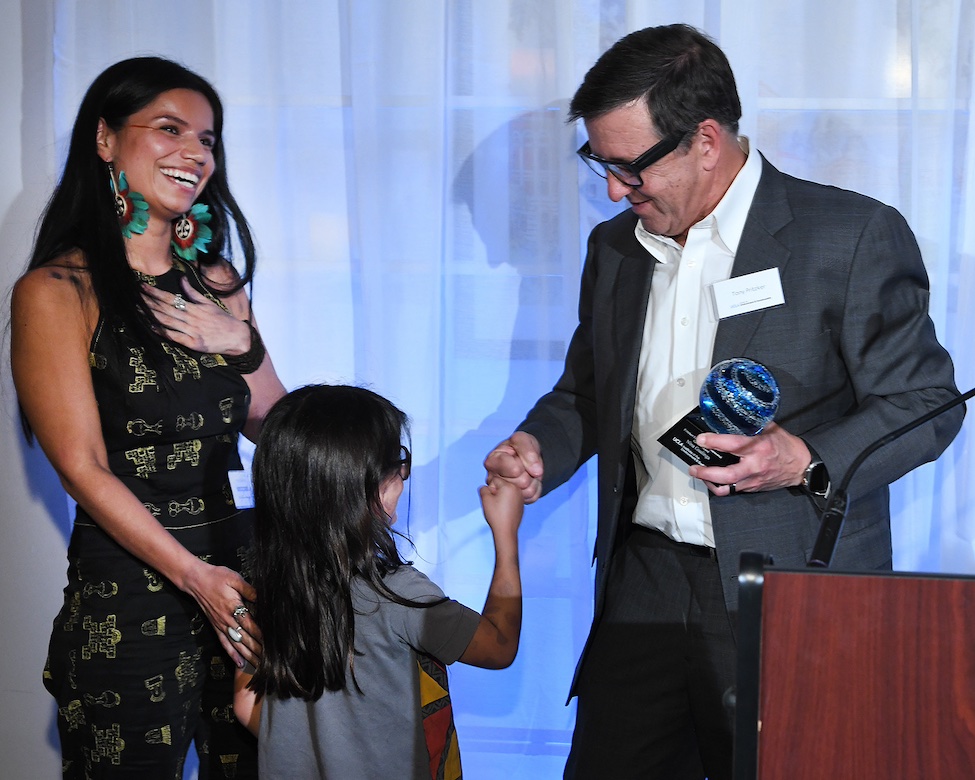 Gualinga accepts the 2024 Pritzker Emerging Environmental Genius Award from Tony Pritzker.