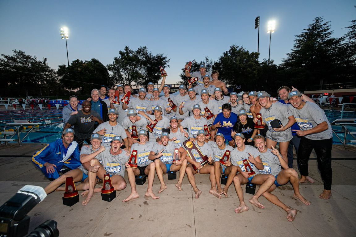 Players and staff of UCLA men's water polo team celebrate their NCAA championship poolside at the Avery Aquatic Center in Palo Alto 
