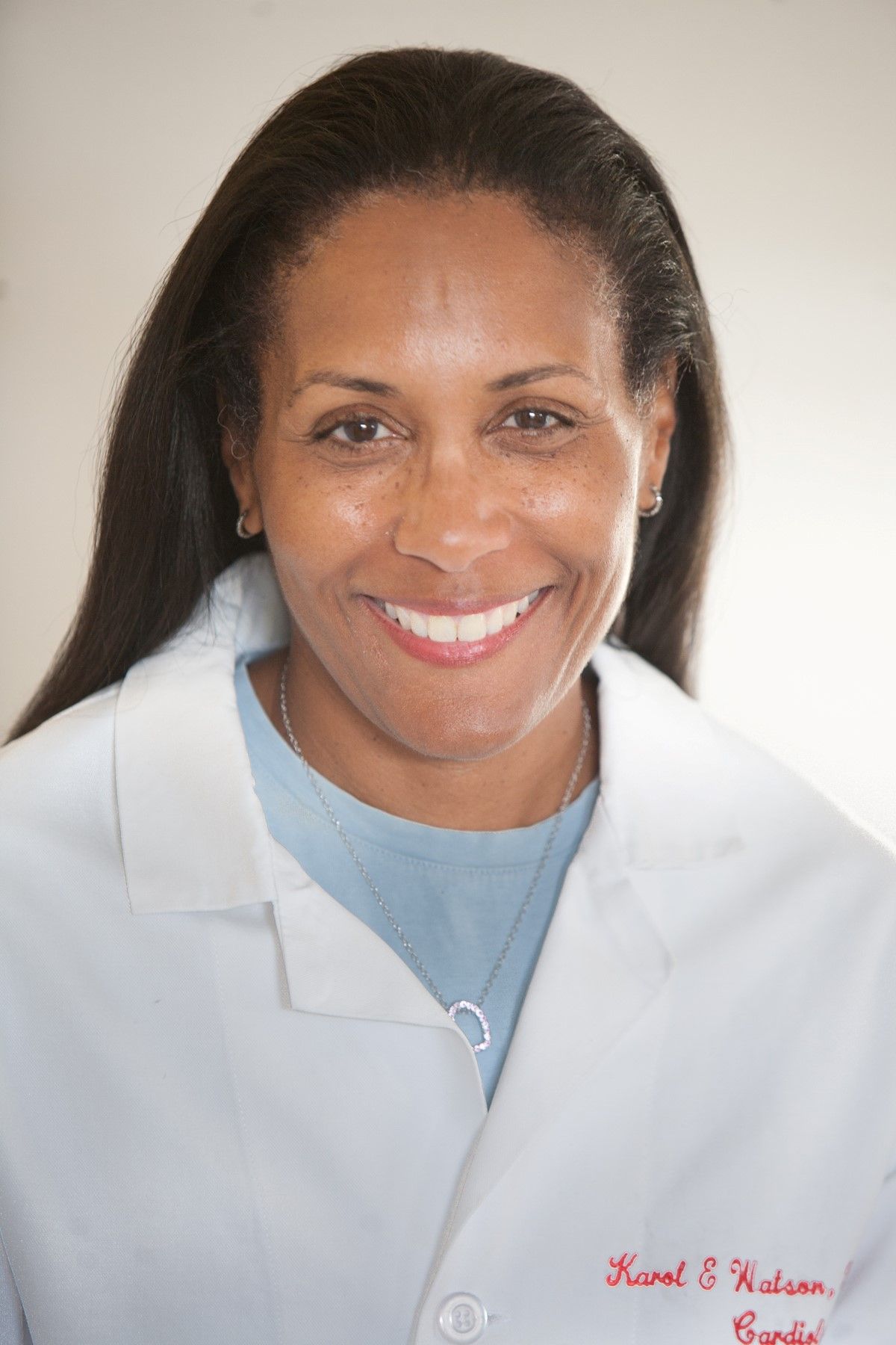 Head-and-shoulders image-of Karol Watson in white lab coat