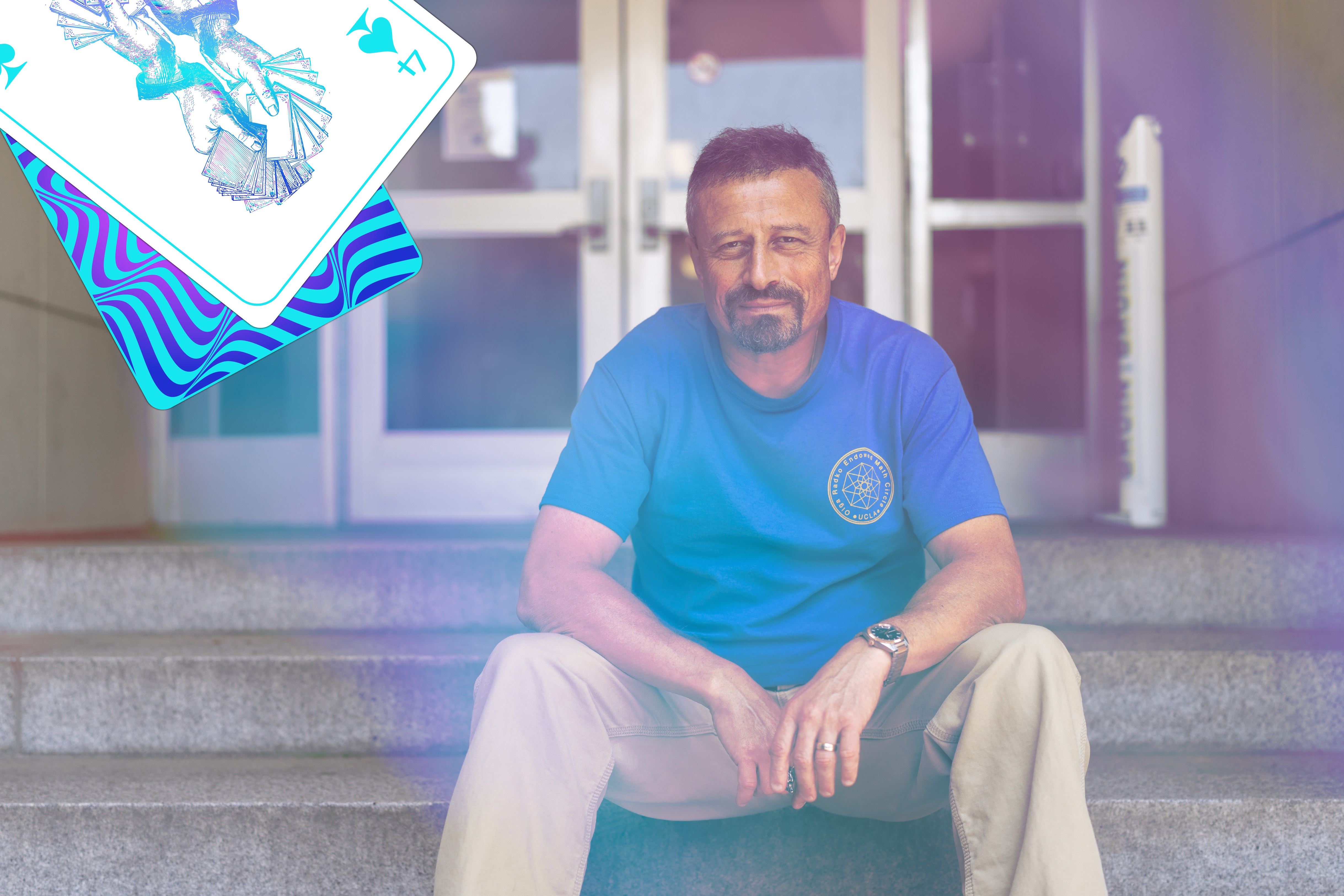 Oleg Gleizer sitting on steps looking at the camera, with two illustrated playing cards on the upper right-hand side.