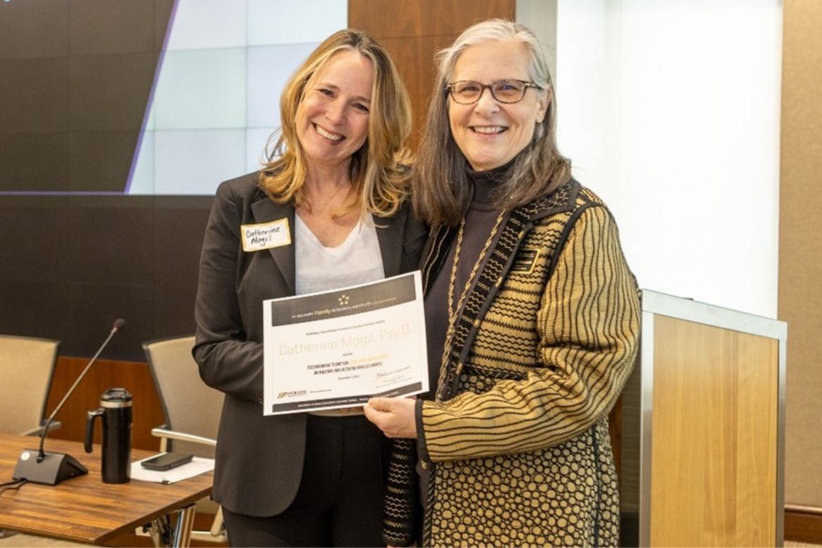 UCLA professor Catherine Mogil with Barbara Thompson Excellence in Research on Military and Veteran Families Award