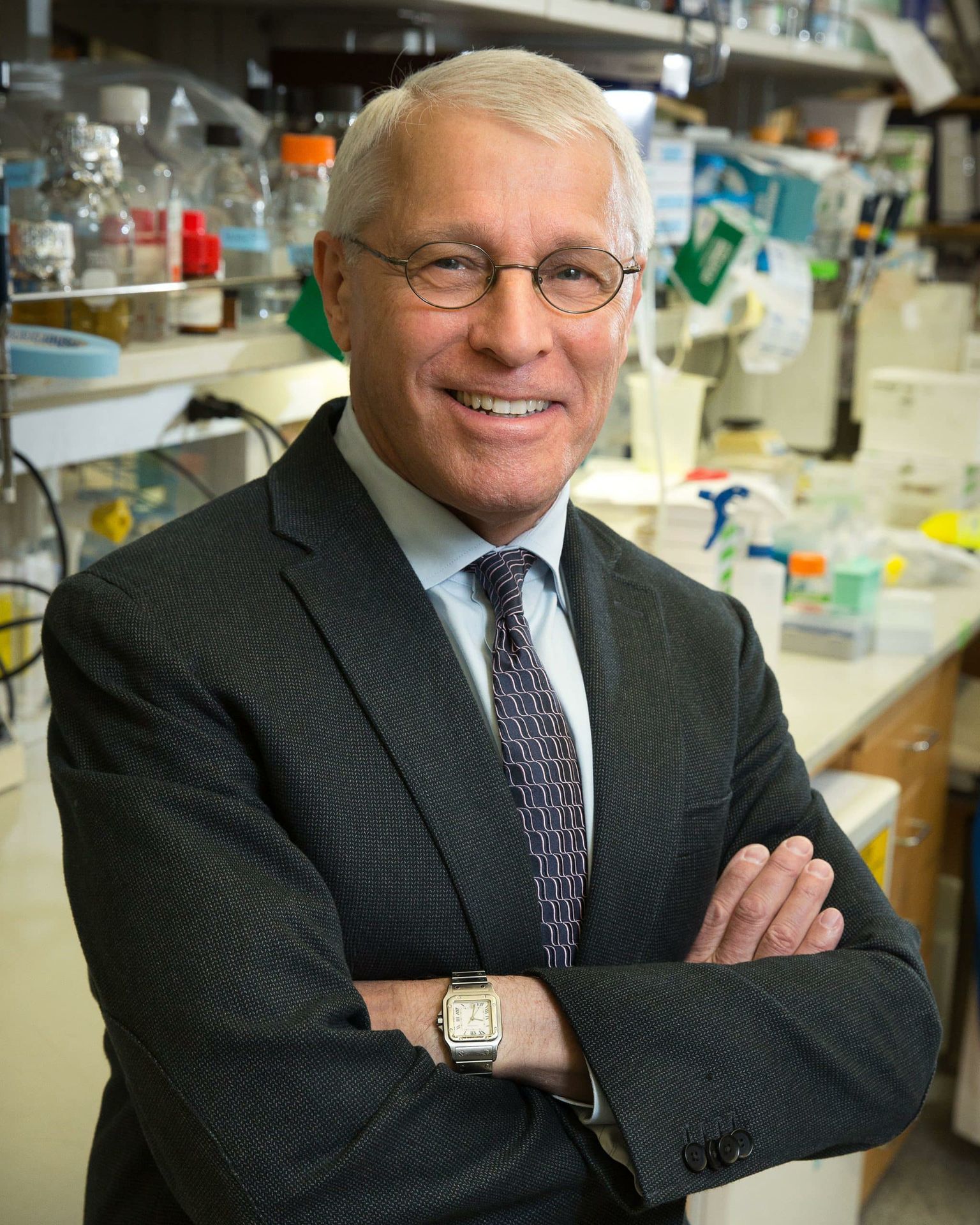 Dr. Owen Witte, arms crossed, in dark jacket and tie