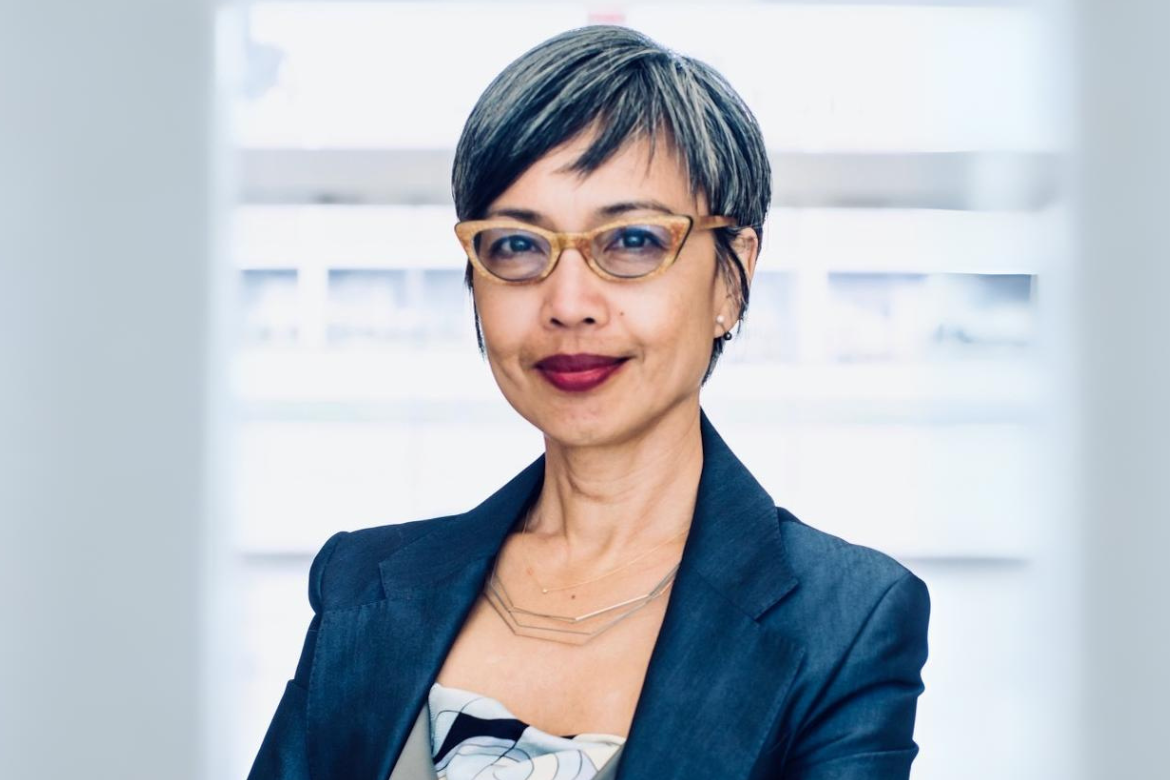 Head-and-shoulders photo of Ninez Ponce wearing glasses and blue top