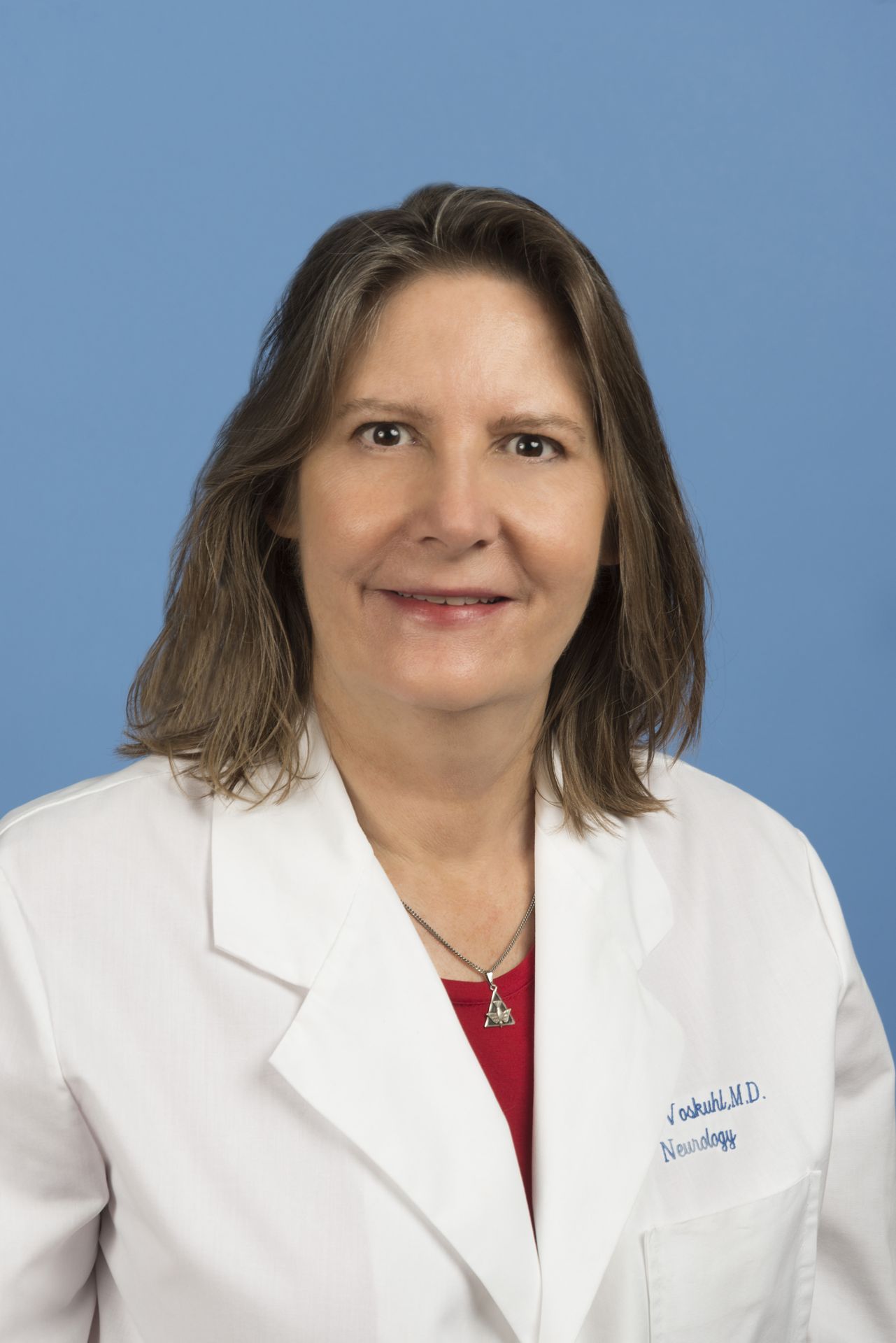 Rhonda Voskuhl in white coat