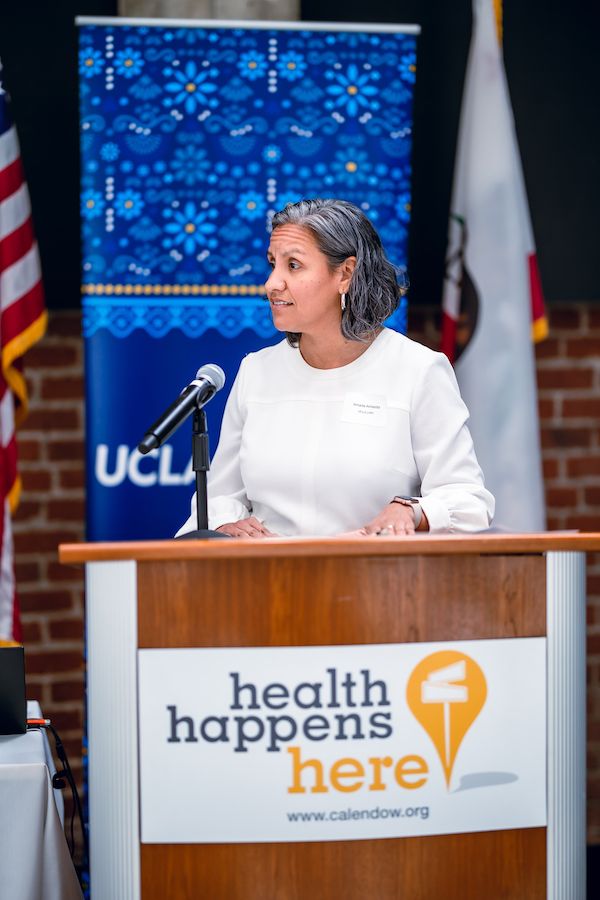 UCLA’s Amada Armenta speaking at podium during the Latino Policy and Politics Institute’s 2024 policy briefing in Sacramento