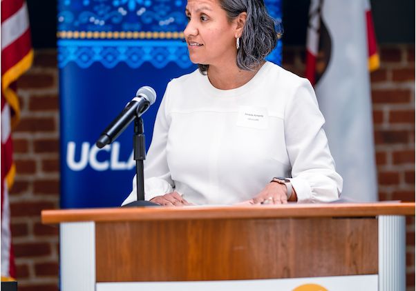 UCLA’s Amada Armenta speaking at podium during the Latino Policy and Politics Institute’s 2024 policy briefing in Sacramento