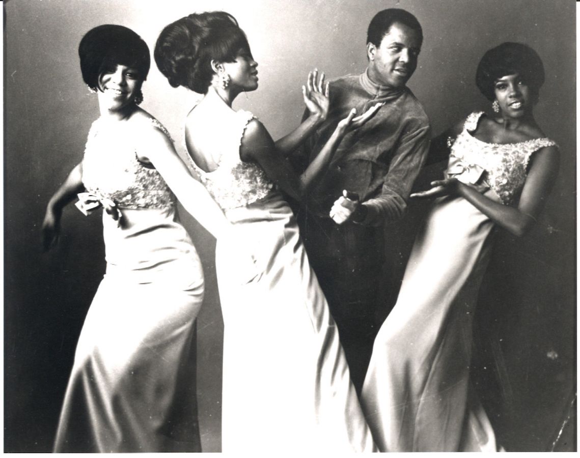 Black-and-white promotional photo of Berry Gordy with the Supremes
