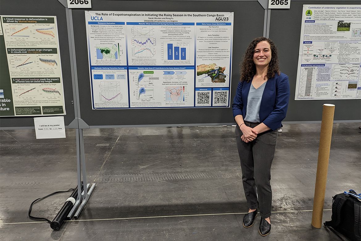 Sarah Worden standing in front of a presentation board