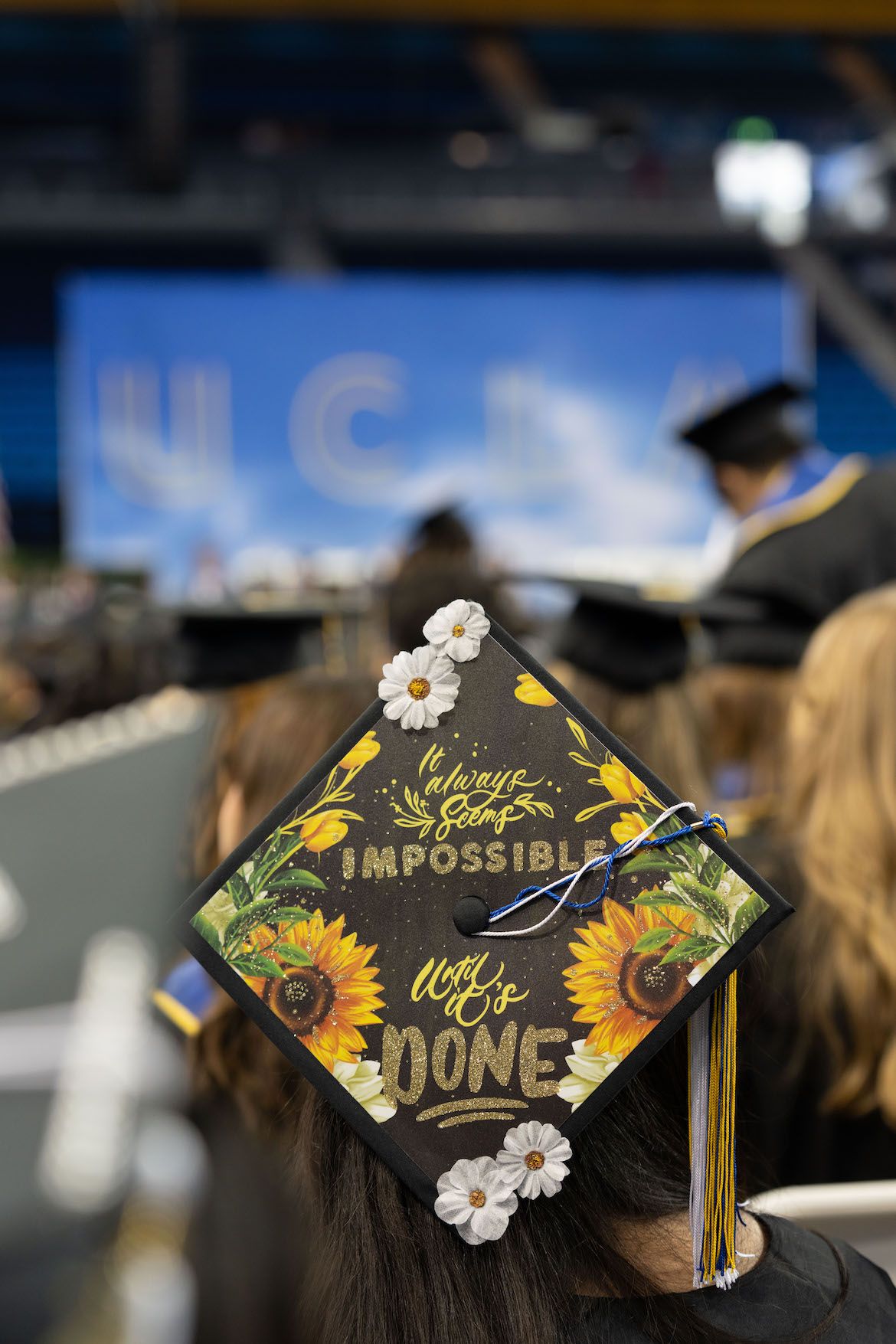 Mortarboard with the slogan “It always seems impossible until it’s done.”