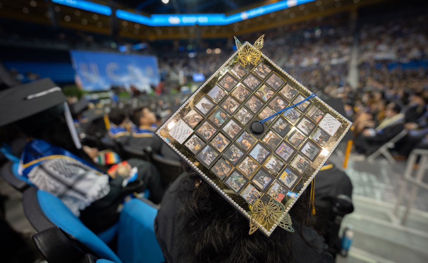 Mortarboard with photos of family and friends