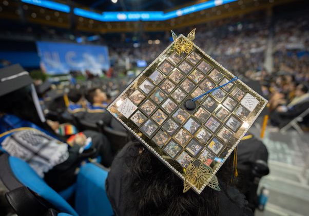 Mortarboard with photos of family and friends