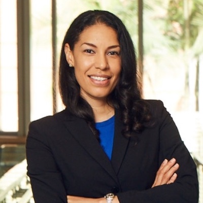 Cropped head-and-torso portrait of Cheryl Lott with arms crossed