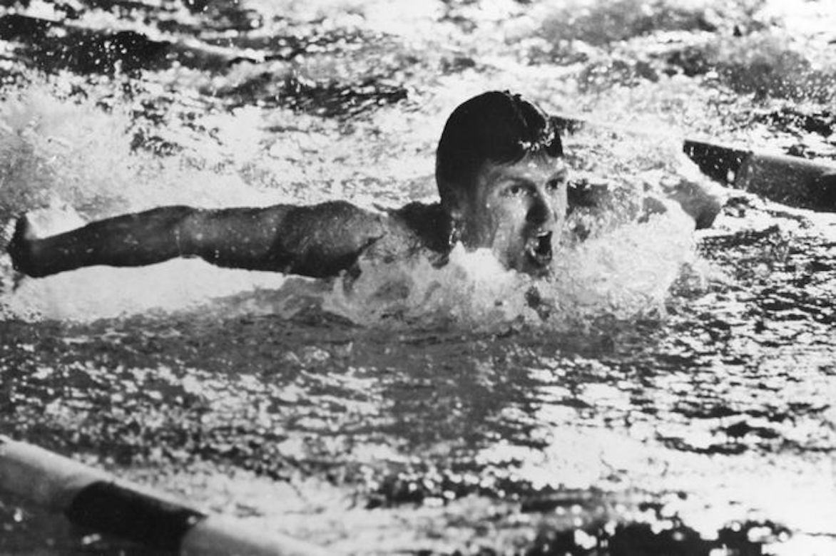 Mike Burton doing the butterfly stroke — black-and-white photo