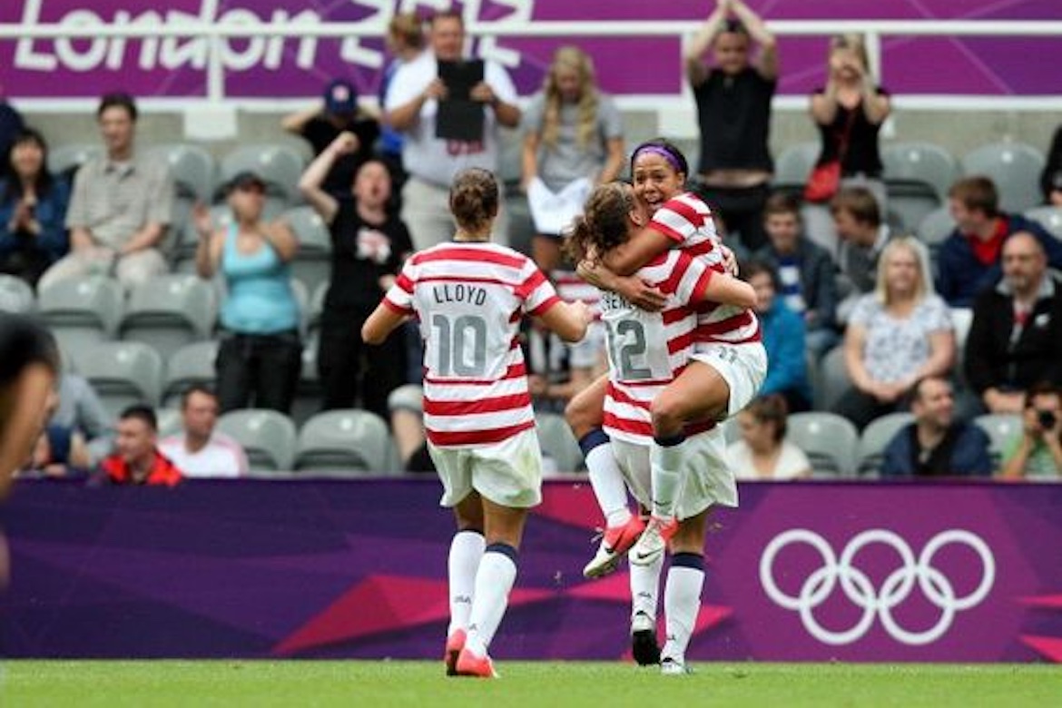 U.S. Olympic women's team players celebrate on the field