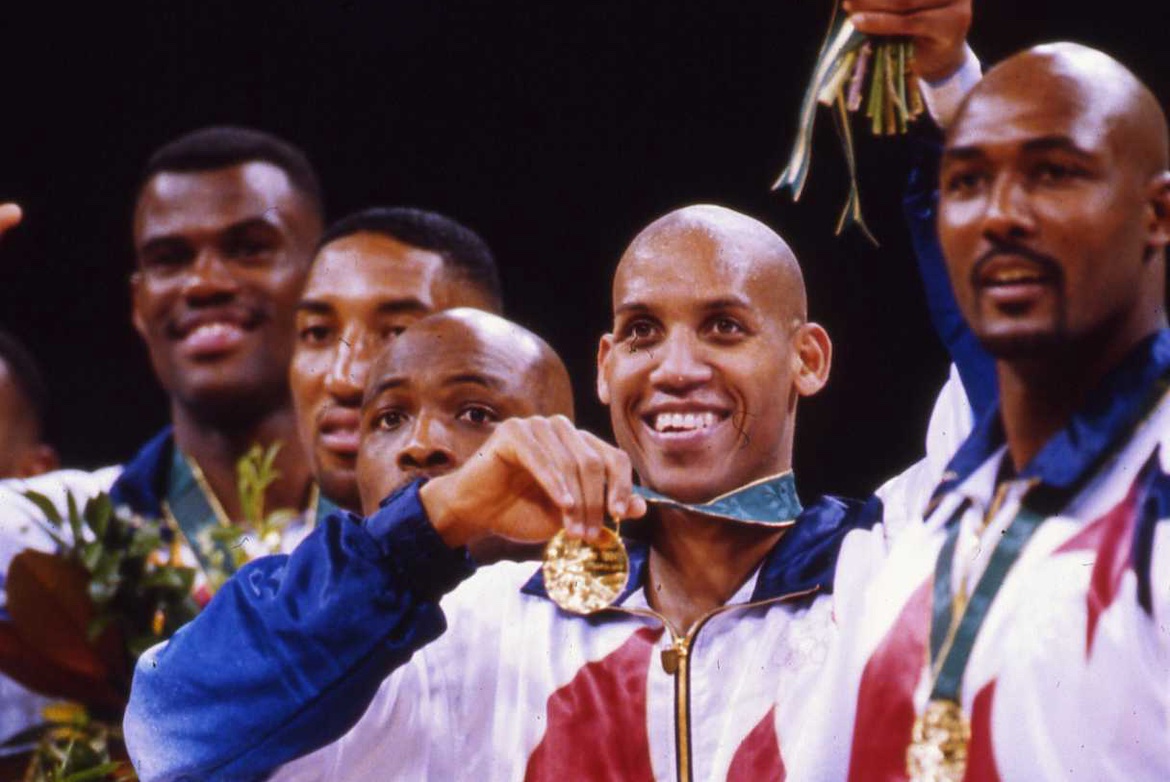 Bruin Reggie Miller holds up his gold medal, along with his Olympic teammates at the 1996 Games in Atlanta.
