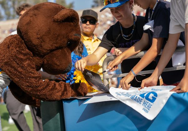 Joe Bruin signing autographs at the Rose Bowl during the game against Indiana, Sept. 14, 2024