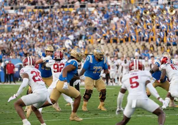 UCLA Bruins in action on field against Indiana at the Rose Bowl, Sept. 14, 2024.