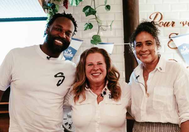 From left to right: Baron Davis, Cori Close and Jenny Johnson Jordan stand together