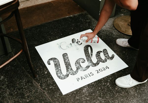 Café UCLA Paris 2024 stencil on ground