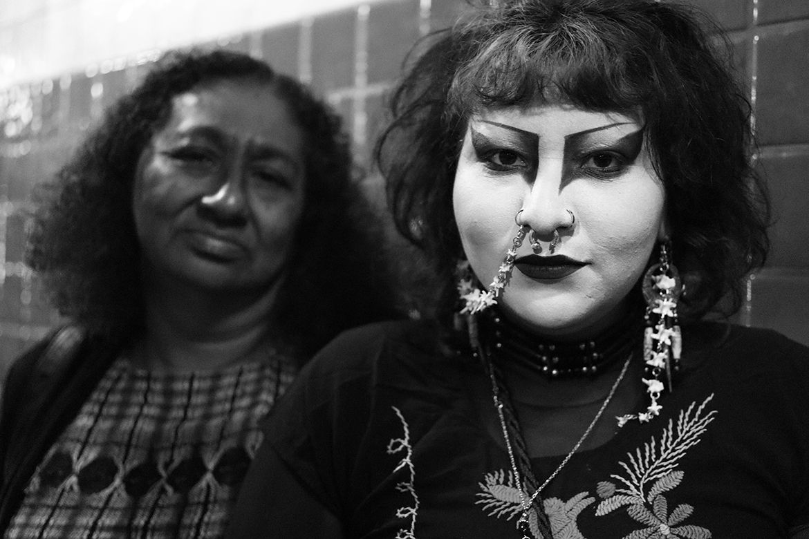 Black-and-white shot of mother, left, and daughter with eye makeup and piercings