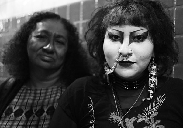 Black-and-white shot of mother, left, and daughter with eye makeup and piercings