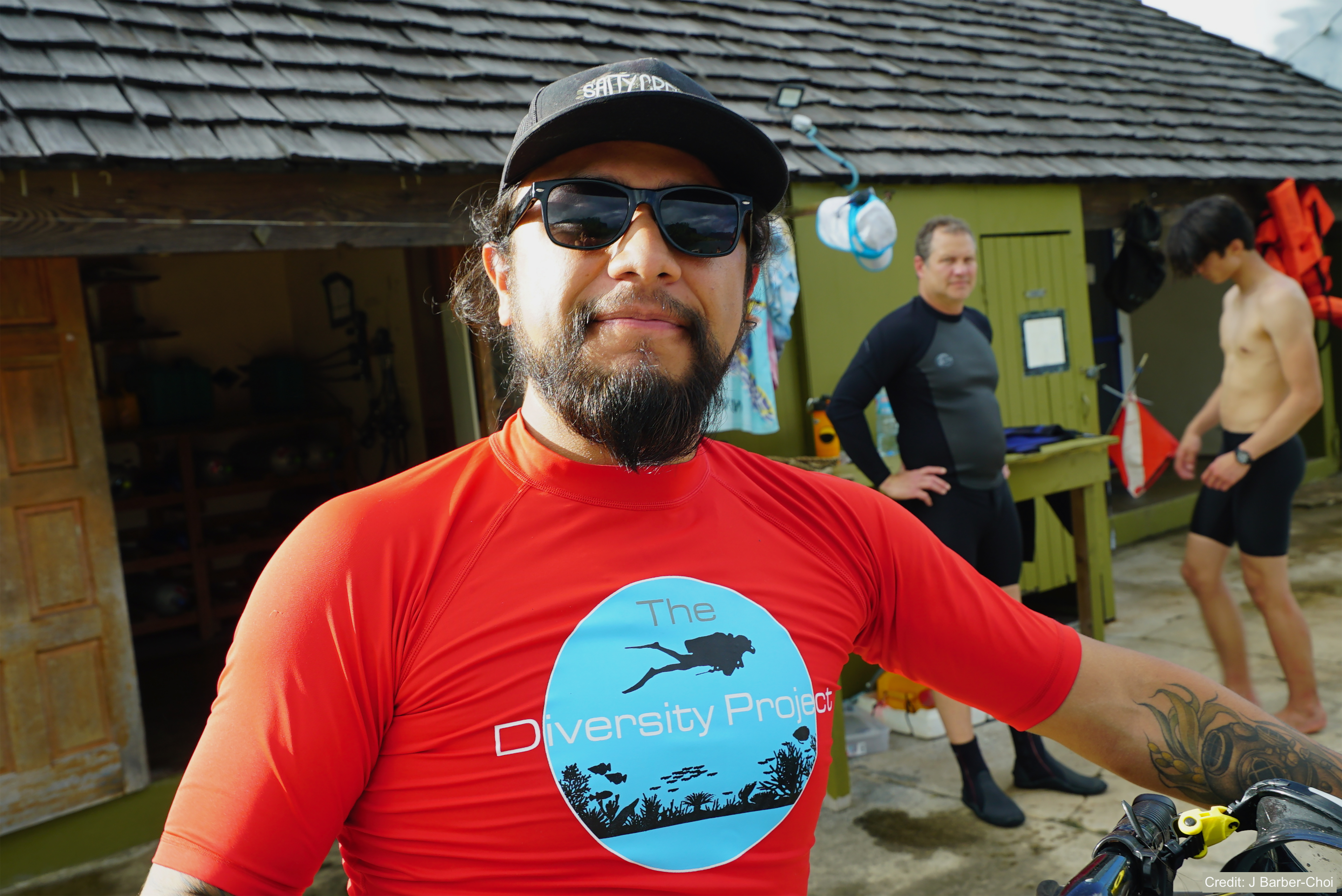 Erick Zerecero, in hat, sunglasses and red shirt