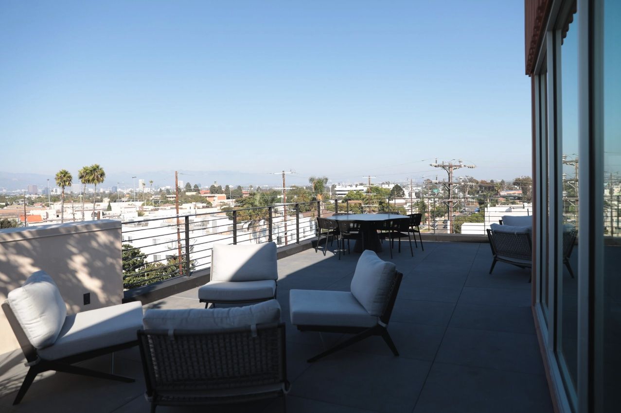 Sundeck with chairs and tables at the Canfield Apartments