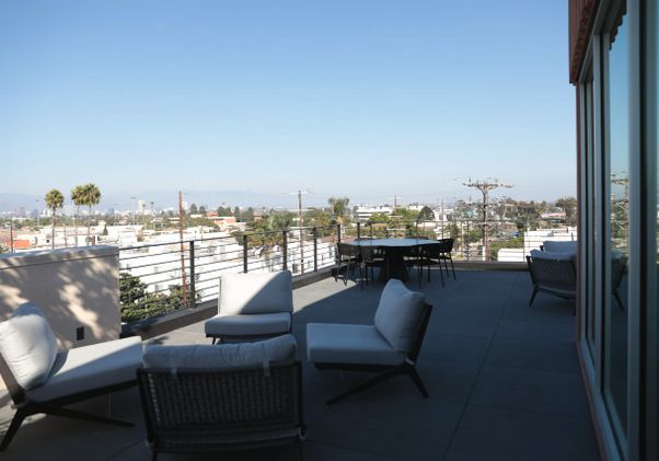 Sundeck with chairs and tables at the Canfield Apartments