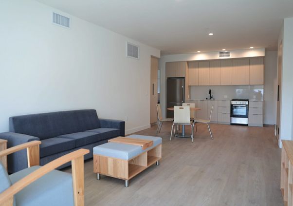 Interior of unit at the Canfield Apartments showing living area and kitchen