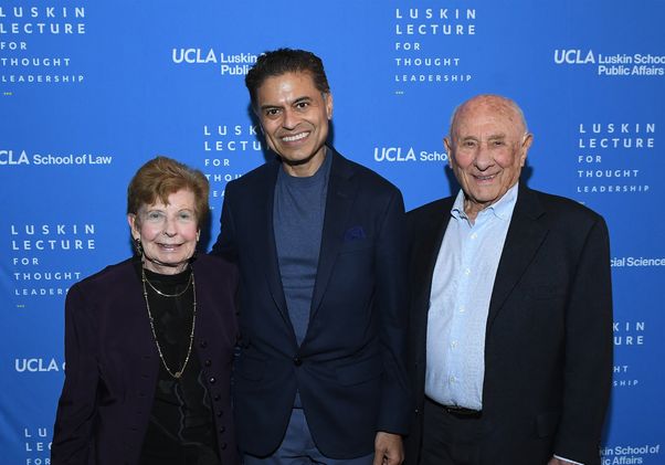 Standing together, from left: Renee Luskin, Fareed Zakaria and Meyer Luskin