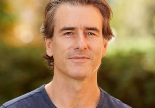 Head-and-shoulders photo of David Walker in blue T-shirt