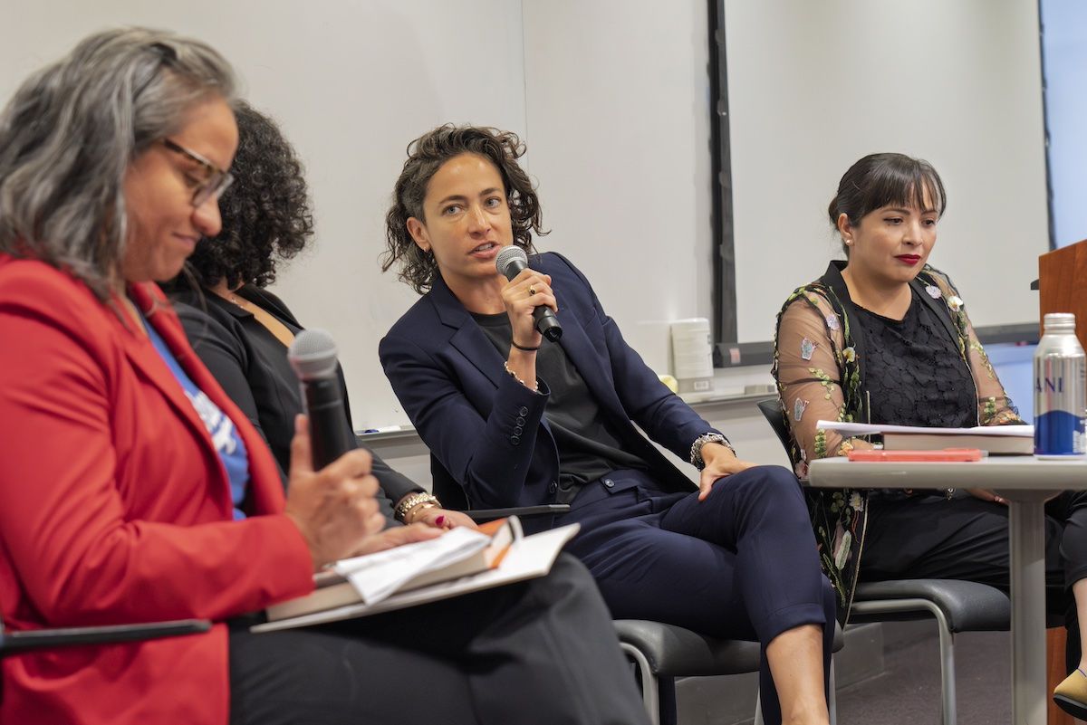 Photo | Paola Ramos (center) speaks on the panel at UCLA. On the right ...