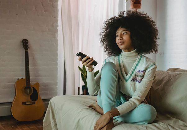 Woman holding remote control