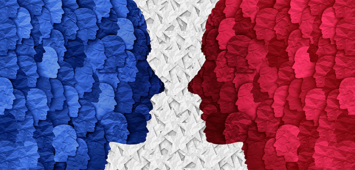 Paper cutout featuring image of blue face on left and red face on right