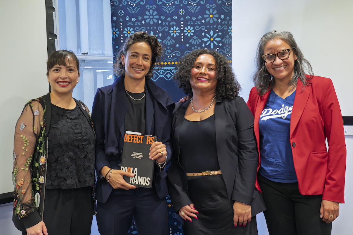 Left to right: Michelle Torres, Paola Ramos (holding her book "Defectors"), Cecilia Lacayo and Amada Armenta stand side by side at panel event.