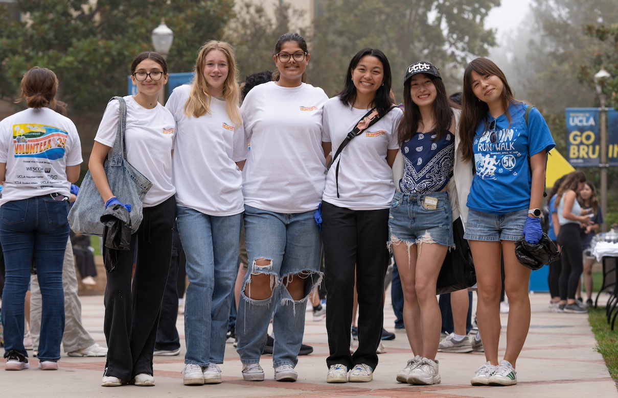 Volunteer Day — Six students standing side by side on campus, preparing to volunteer.