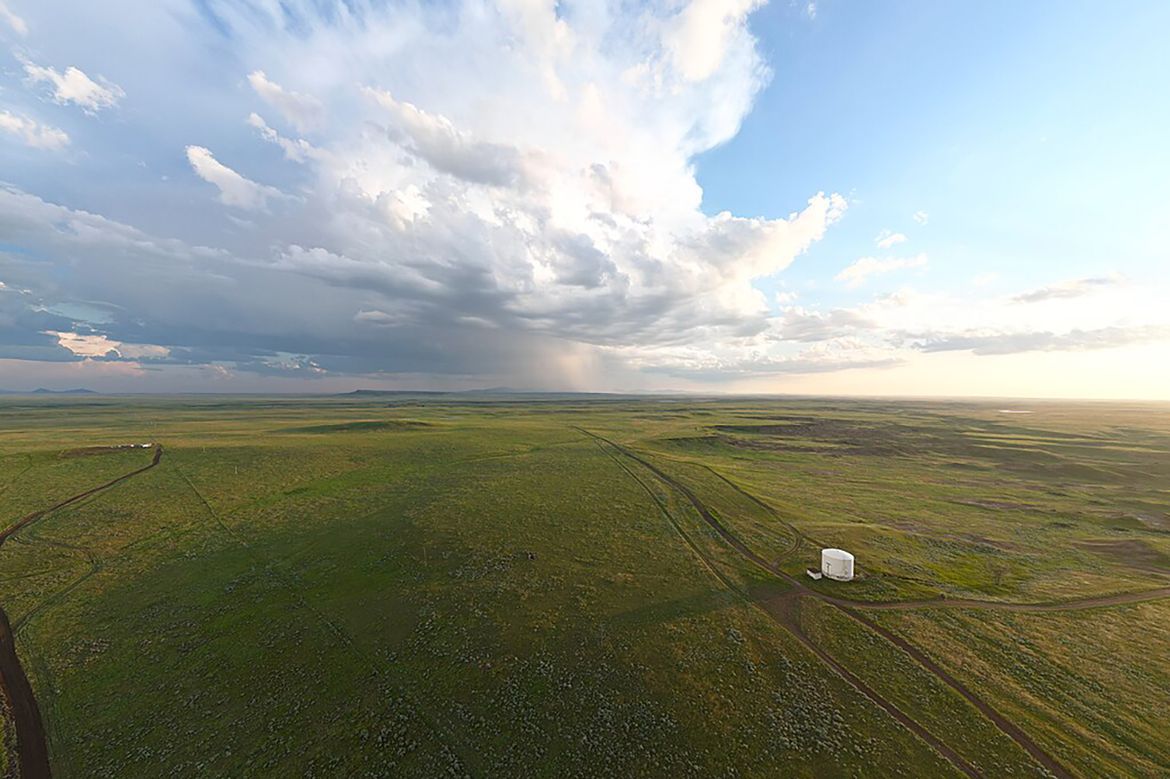Fort Belknap Reservation image shows rolling plains and clouds in sky