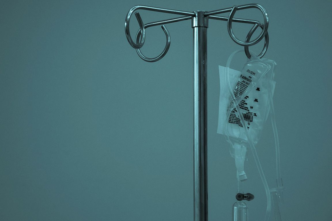 An IV bag hanging on a drip stand