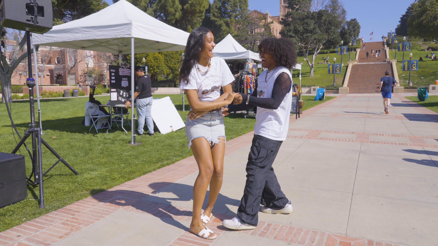 Jasmine Aner and Matthew Morales-Boyd dancing together outdoors 