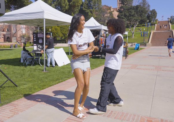 Jasmine Aner and Matthew Morales-Boyd dancing together outdoors 