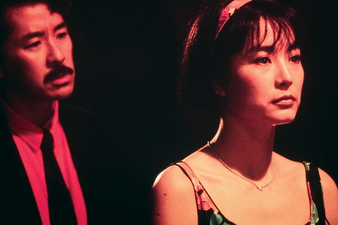 A film still from "Starry Is the Night" (1988), directed by Ann Hui, showing two characters in dramatic red-toned lighting.