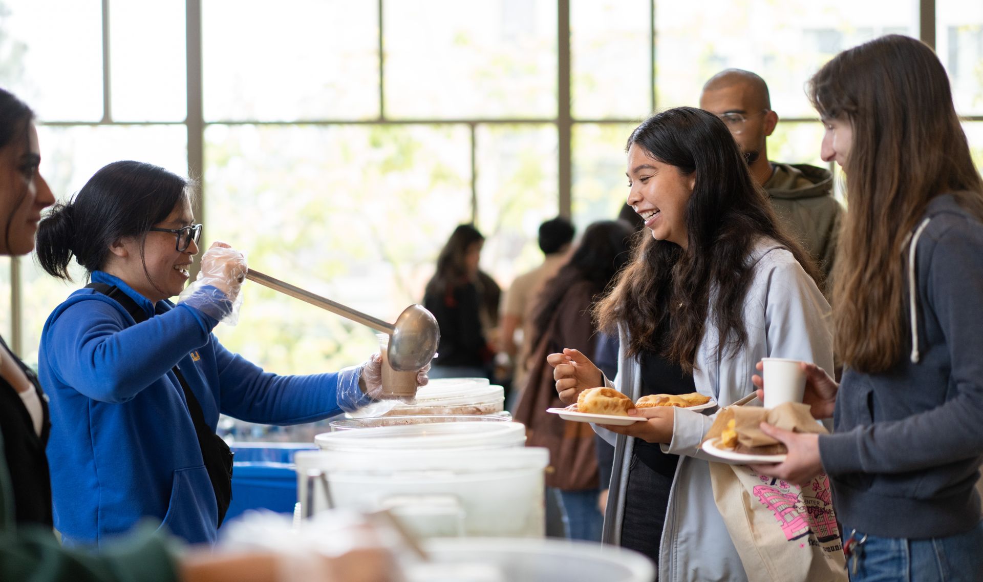 Students enjoy food at the opening of the Latinx Success Center