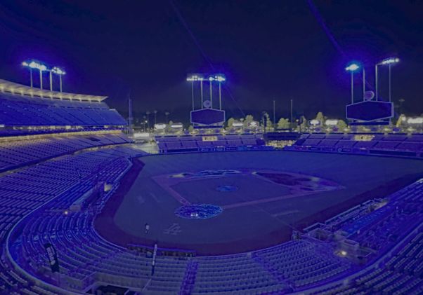 Wide shot of Dodger Stadium lit up in blue