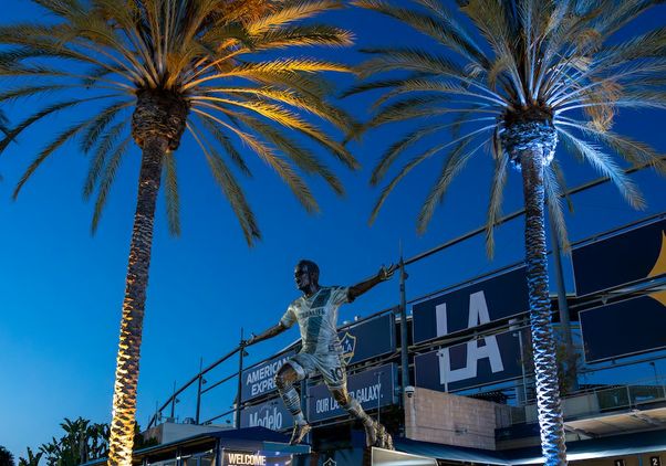 Entrance to Dignity Health Sports lit up in blue