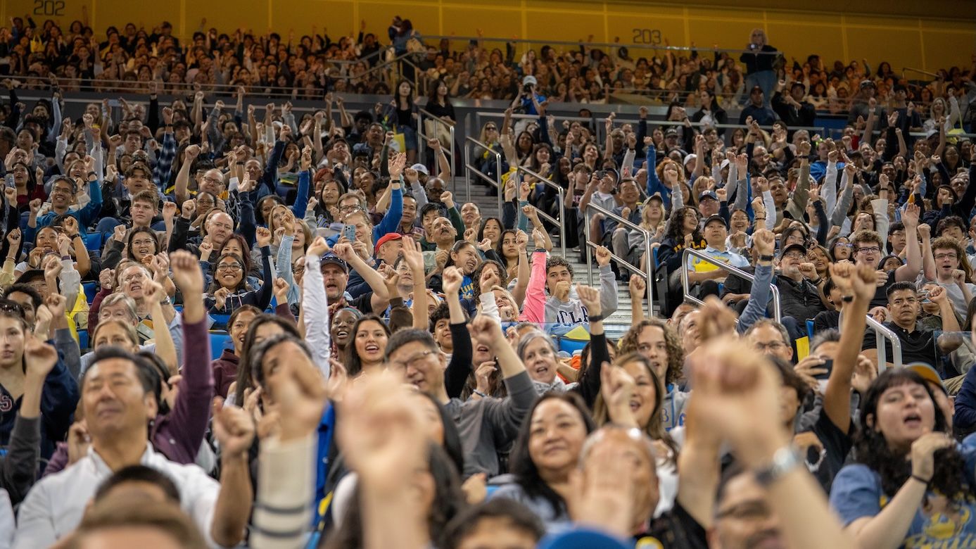 Learning the eight-clap: A jubilant crowd in Pauley Pavilion gets a head start on the Bruin tradition, thanks to the UCLA Spirit Squad