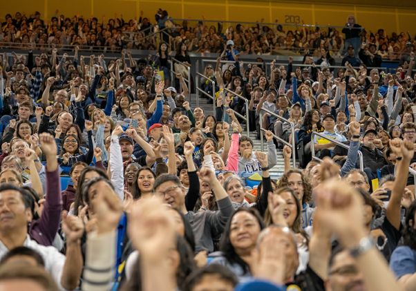Learning the eight-clap: A jubilant crowd in Pauley Pavilion gets a head start on the Bruin tradition, thanks to the UCLA Spirit Squad