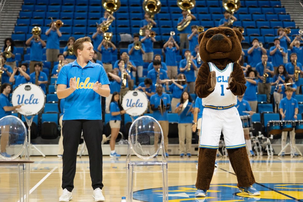 Bruin Day–A member of the UCLA Spirit Squad and Joe Bruin perform for the crowd in Pauley Pavilion